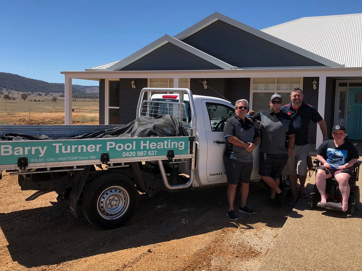 Photo of our Sydney pool heating team standing infront of our work truck